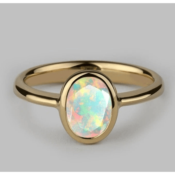 Anillo solitario con ópalo corte cabujón ovalado de 18.2x12.6x6.8mm en oro de 14k talla 10 1/2