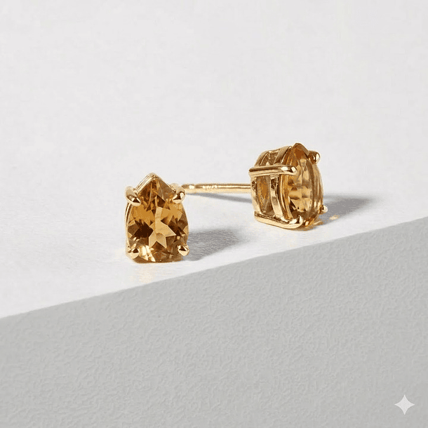 Aretes en oro amarillo de 14k con par de citrinos pera de  7.9x5.8mm