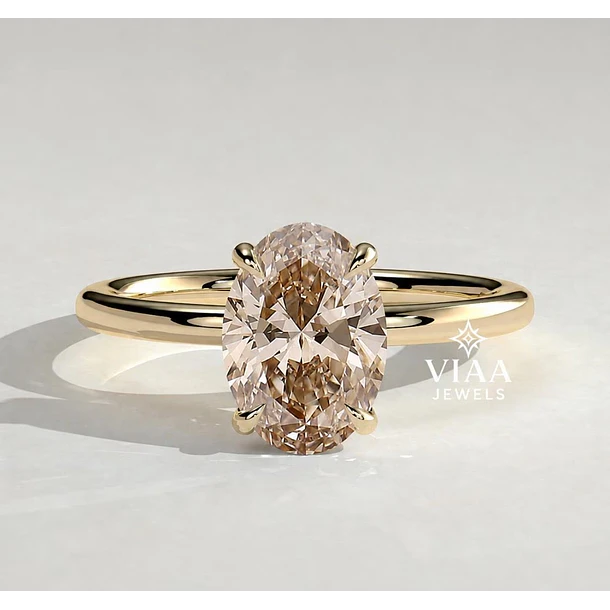 Anillo solitario en oro amarillo de 14k con Zafiro rosa oval. Talla 6.5