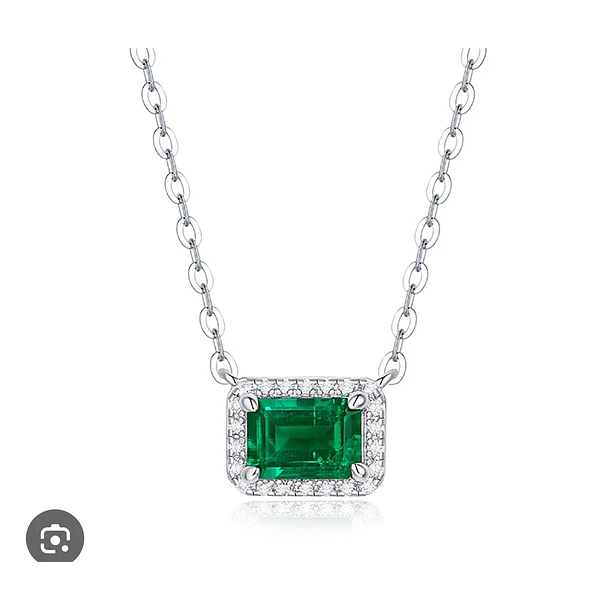 Dije en oro blanco de 14k con esmeralda octágono y halo brillante de diamantes negros de 1.5mm