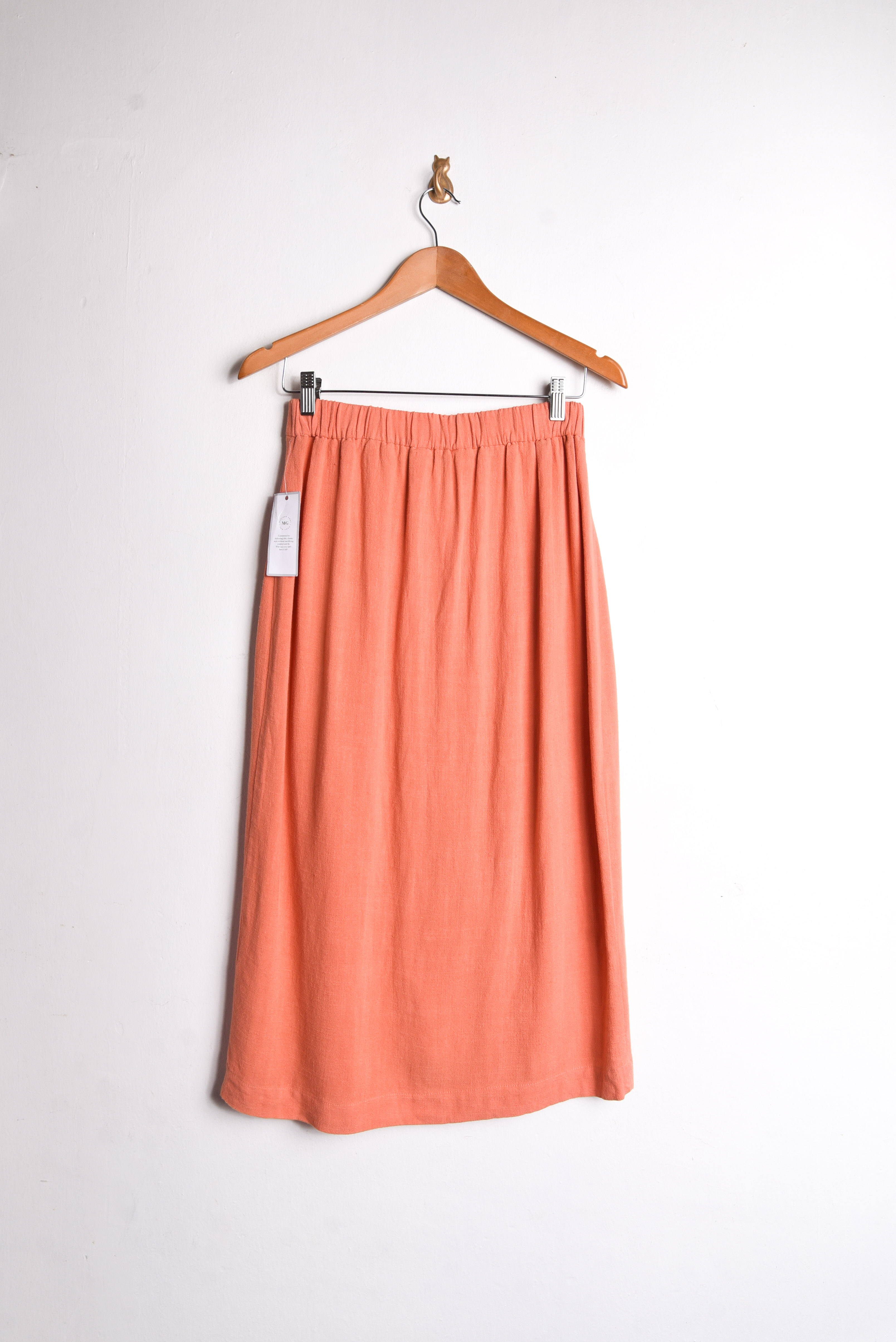 Falda naranja botones