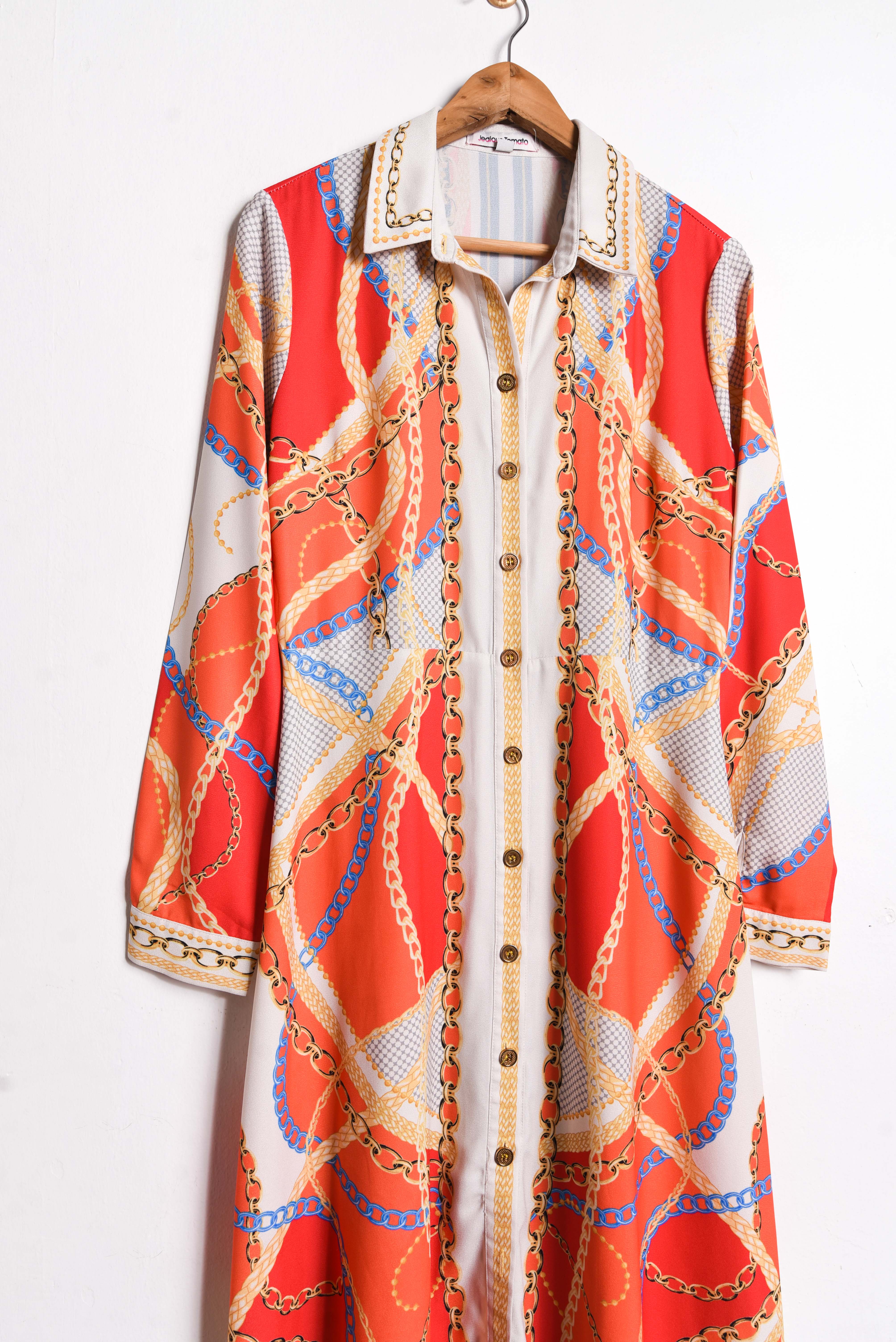 Vestido naranjo print cadenas