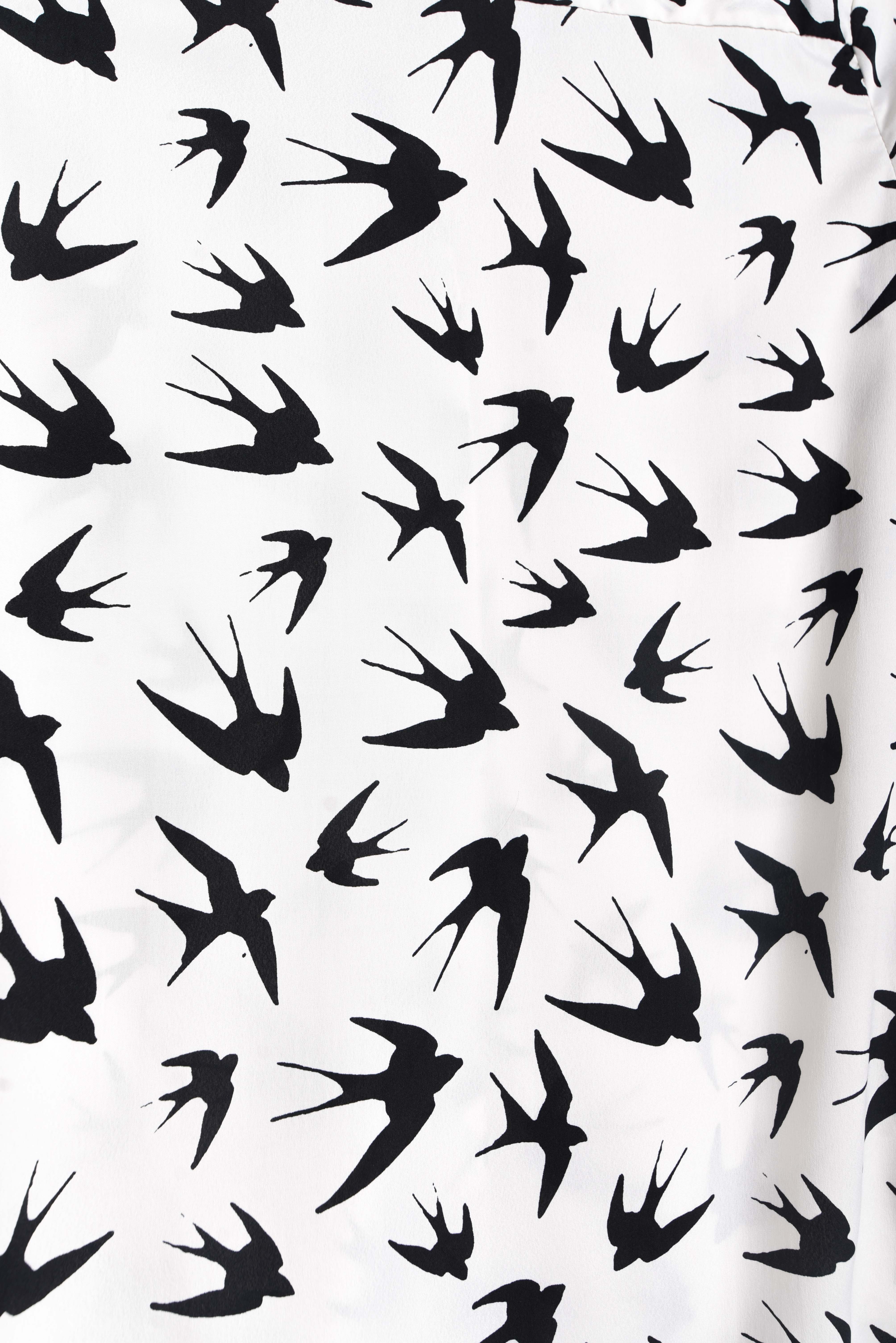 Blusa blanca golondrinas