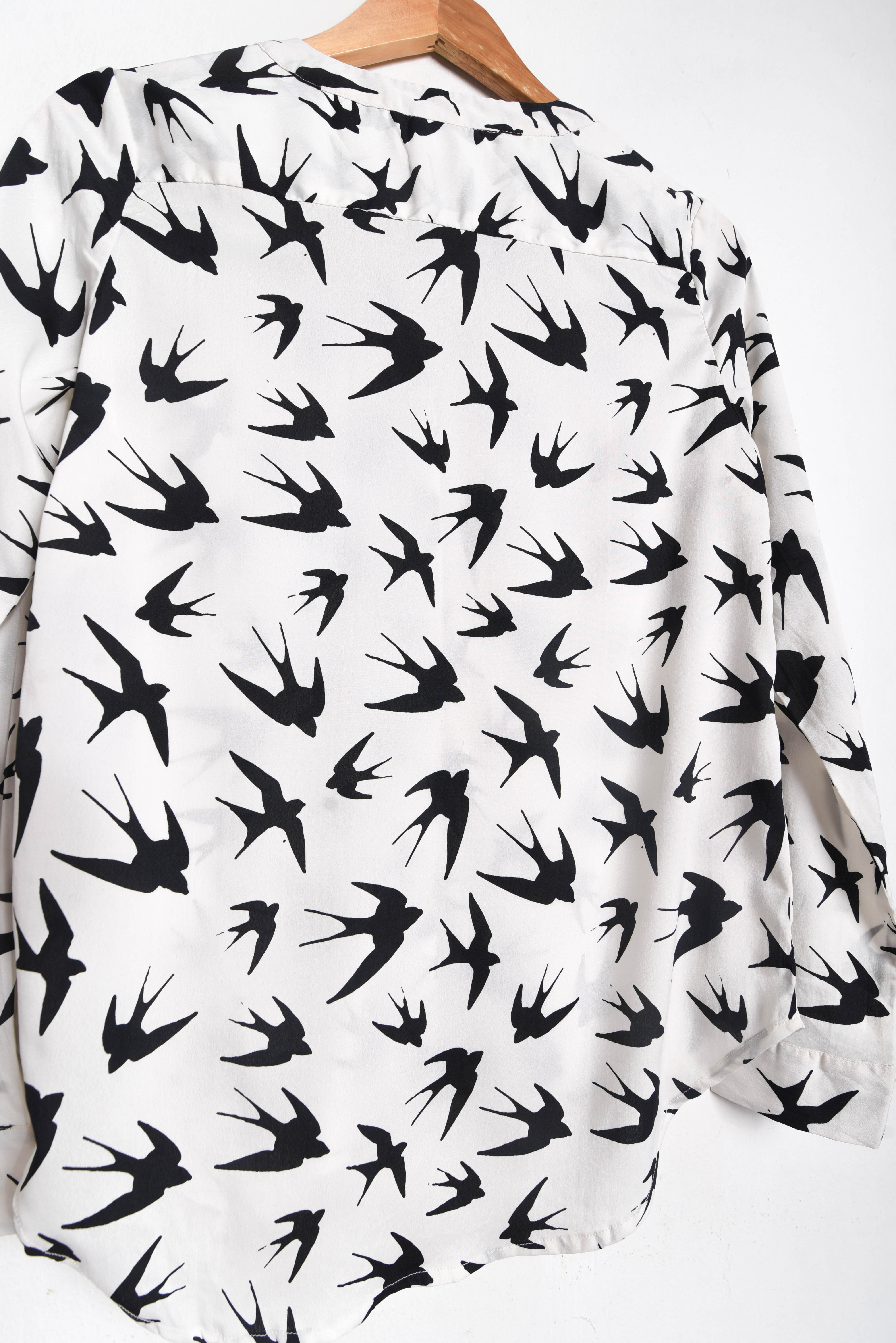 Blusa blanca golondrinas