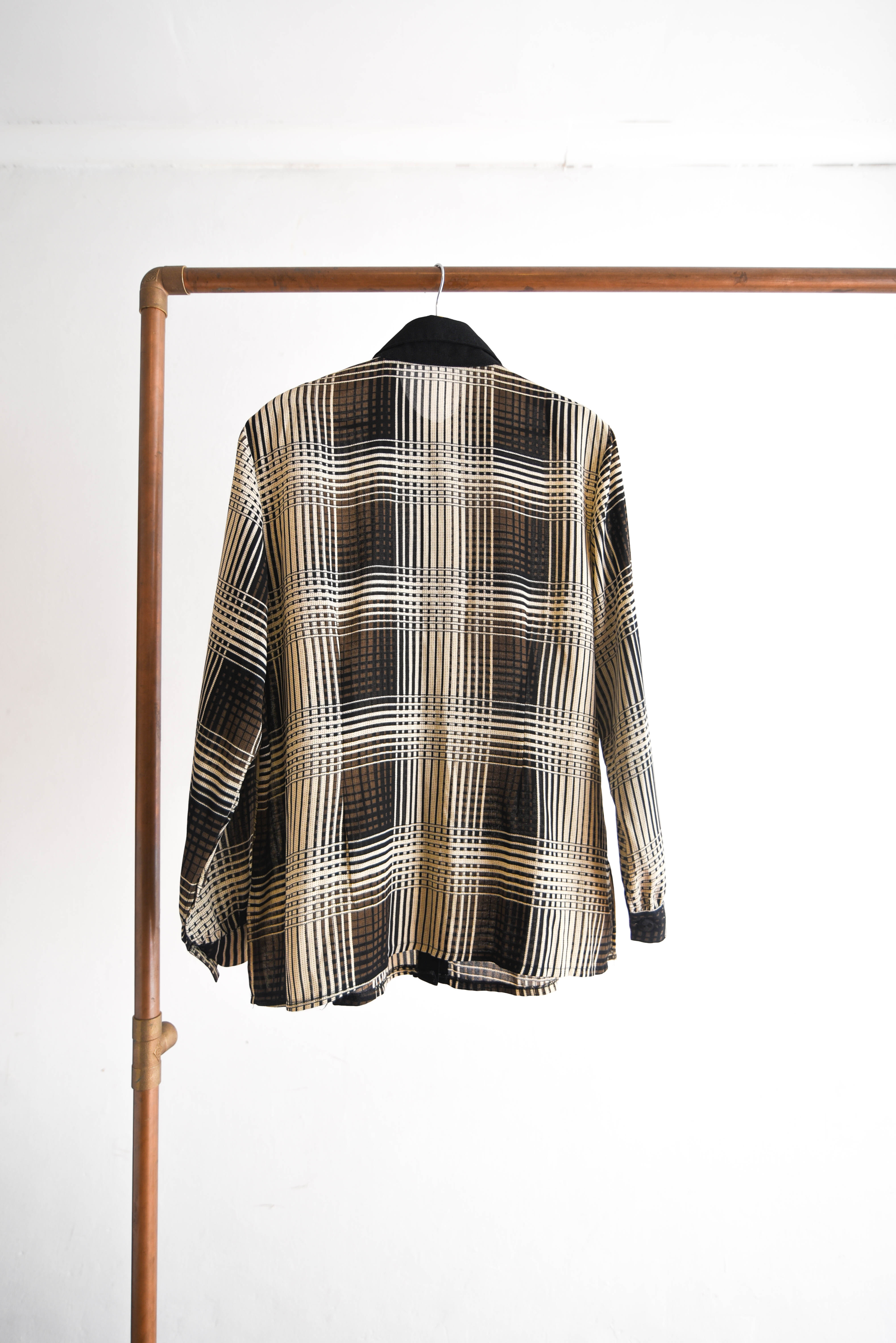 Blusa tartán café y negro