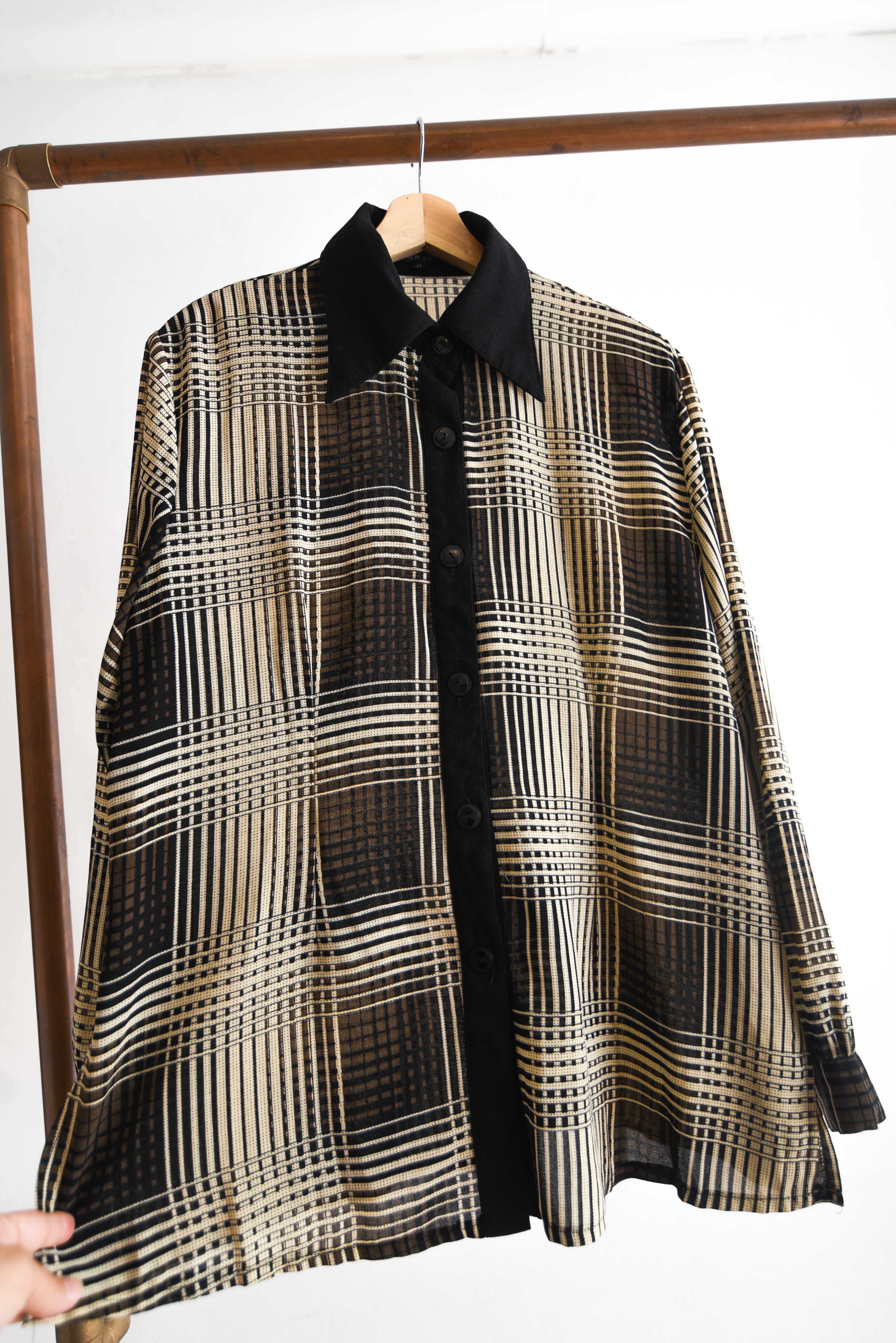 Blusa tartán café y negro