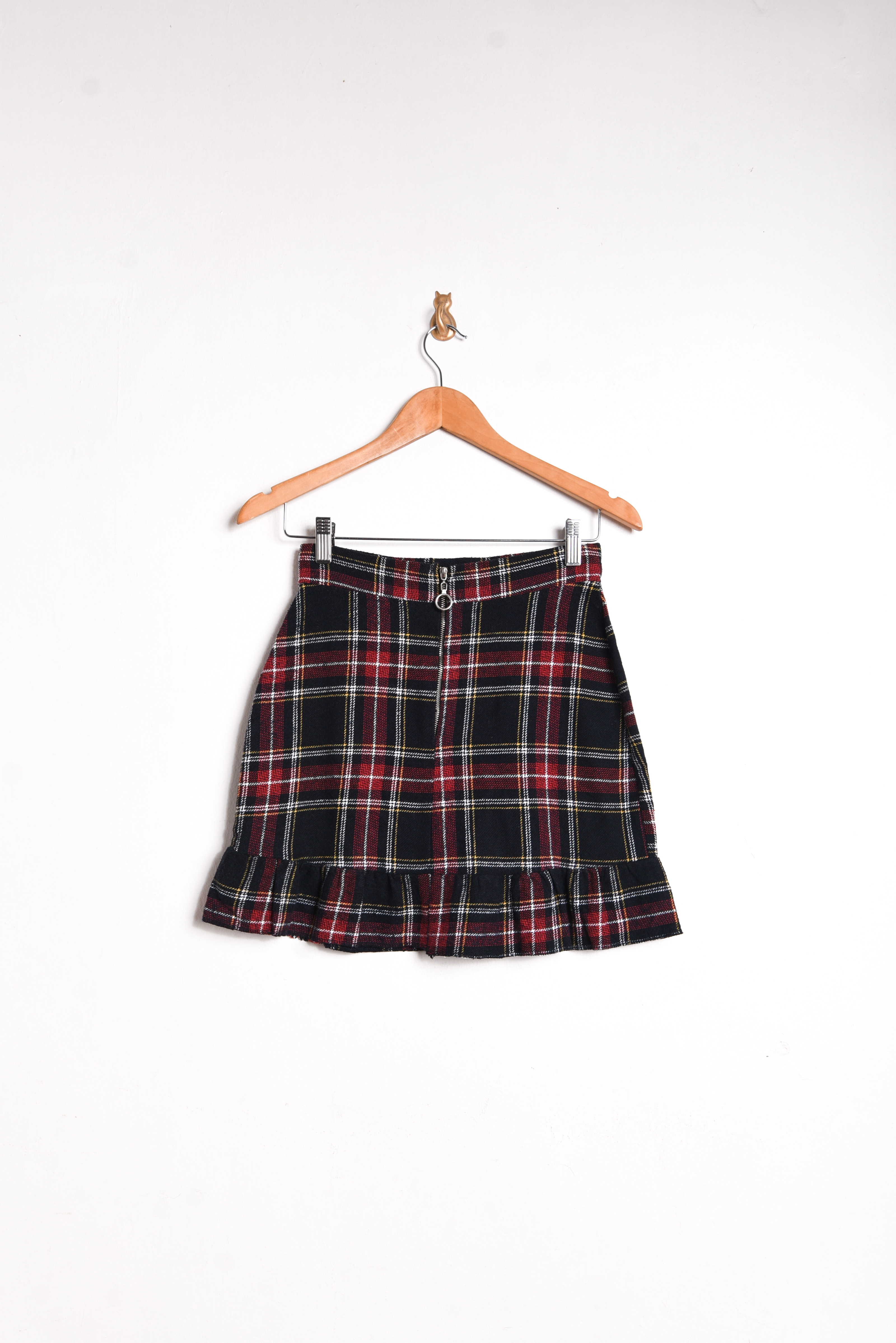 Mini falda negra tartán vuelos