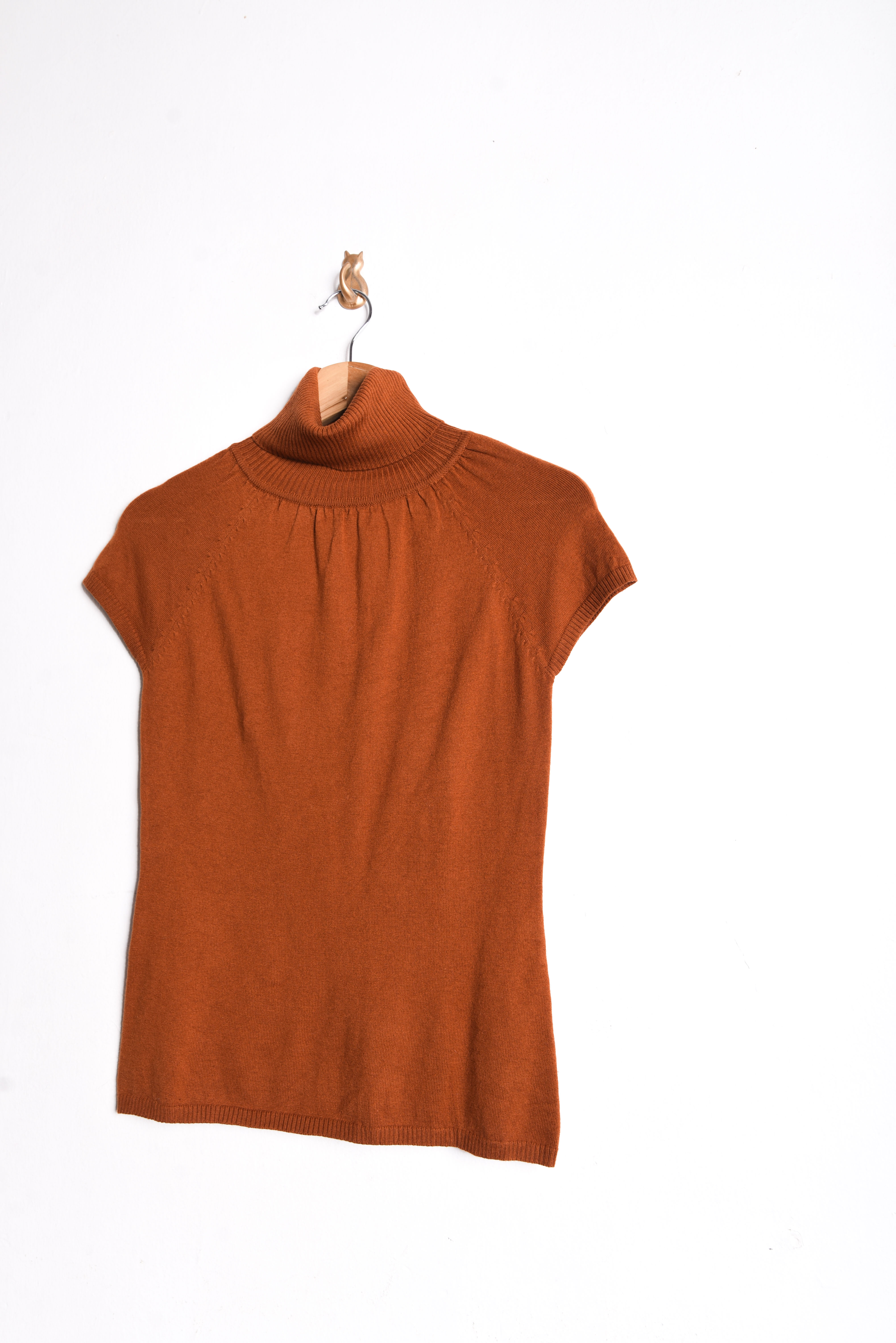 Top tejido naranjo cuello alto