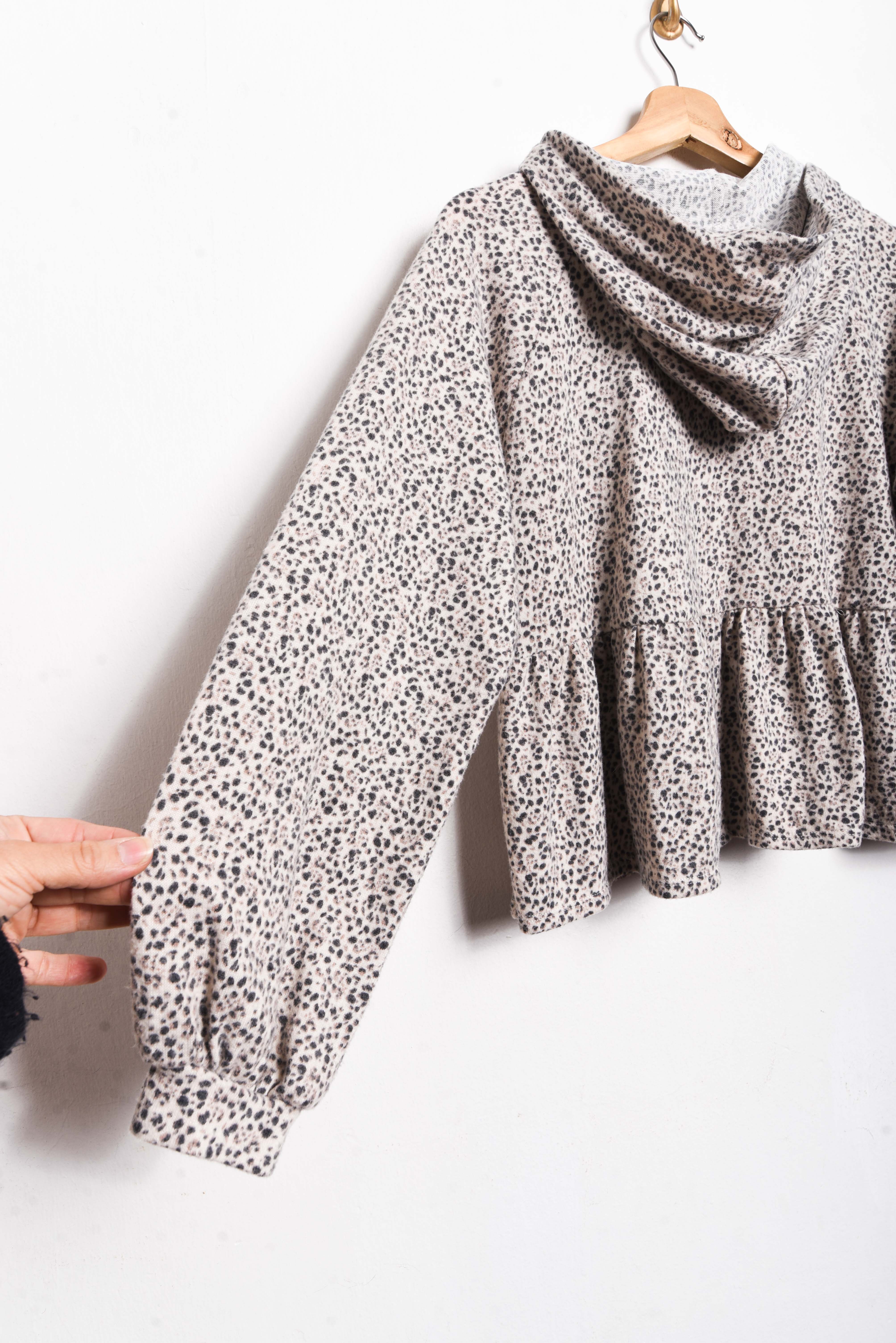 Polerón gris animal print vuelos