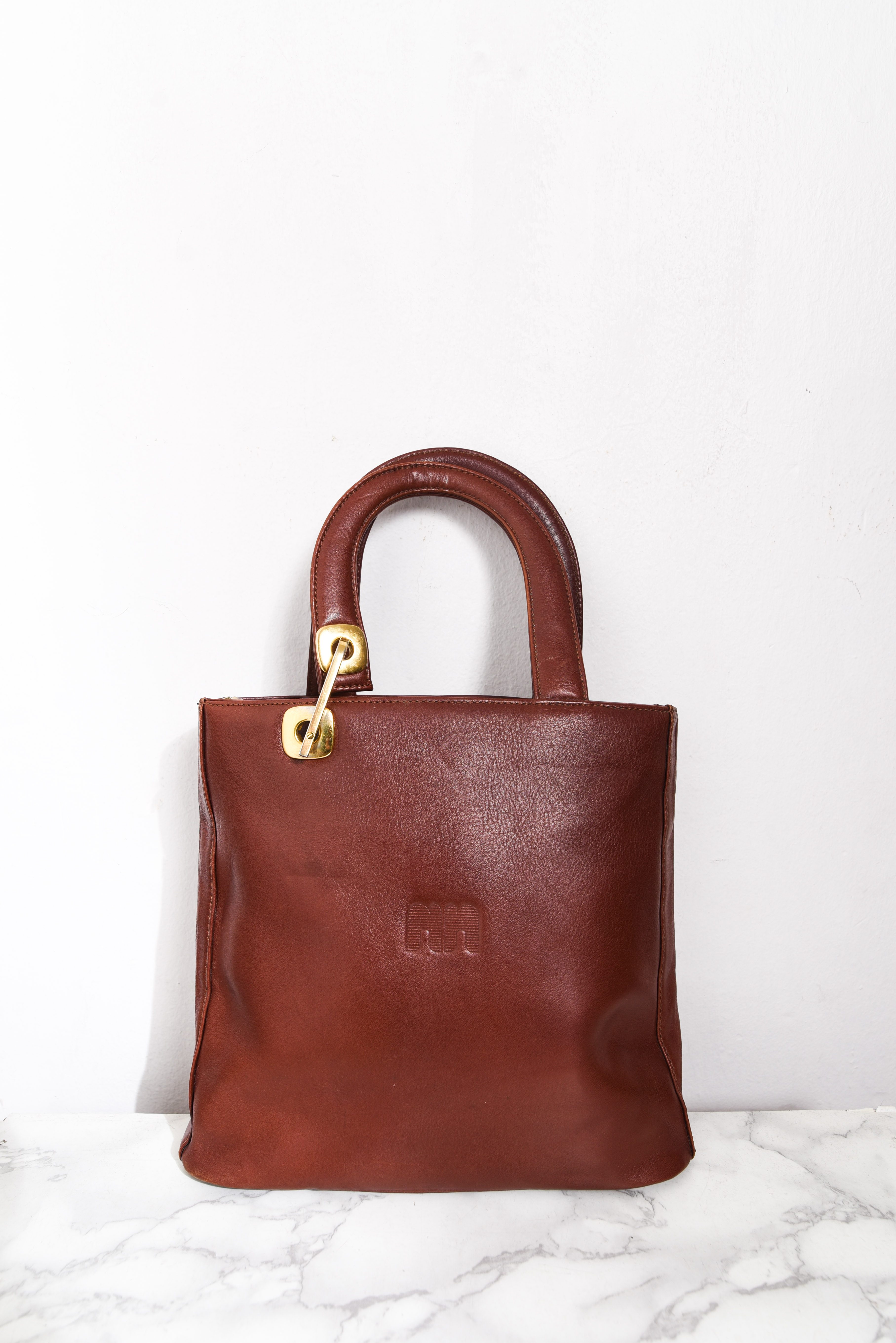 Cartera de mano café cuero vintage
