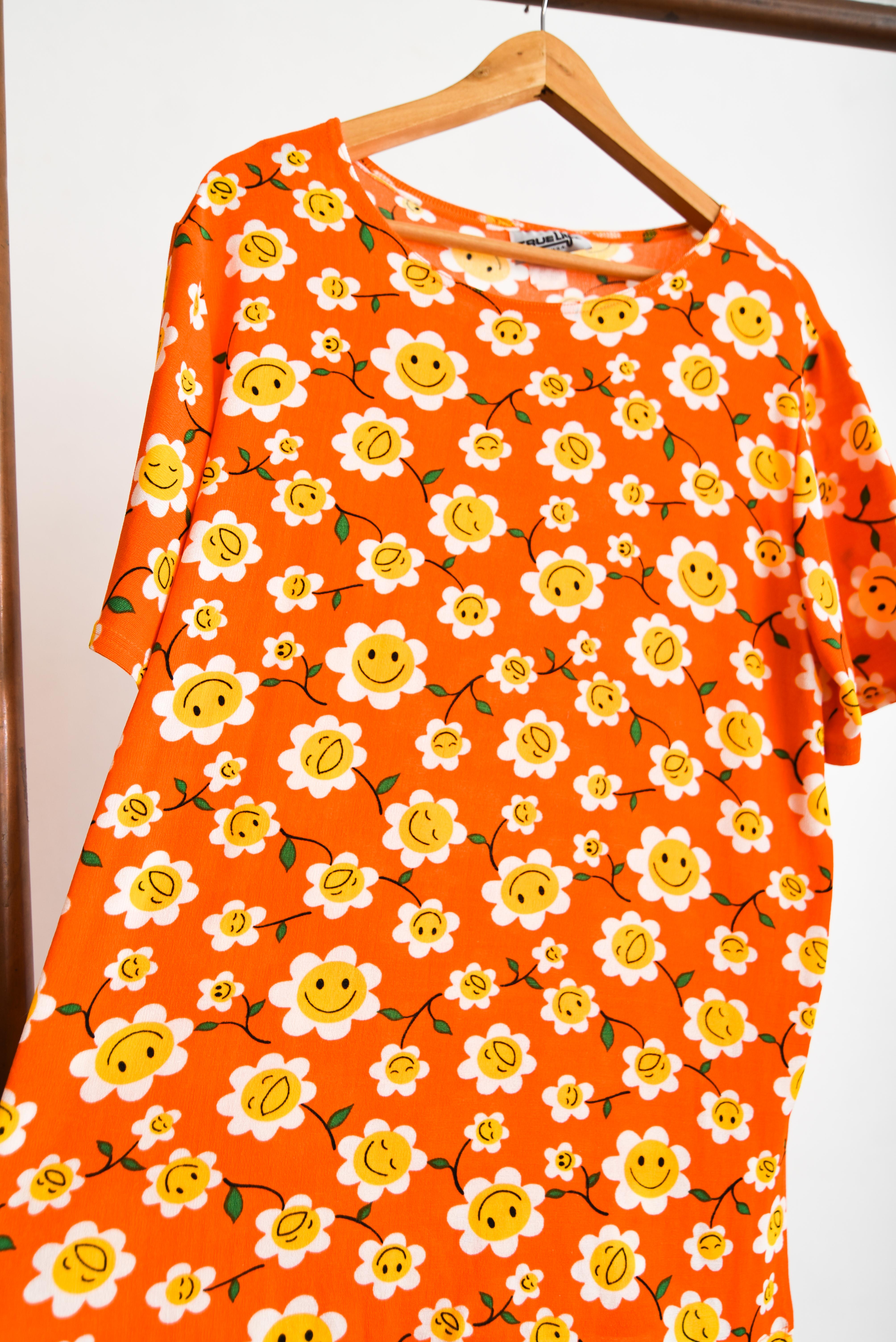 Polera naranja 90s smiley floral 