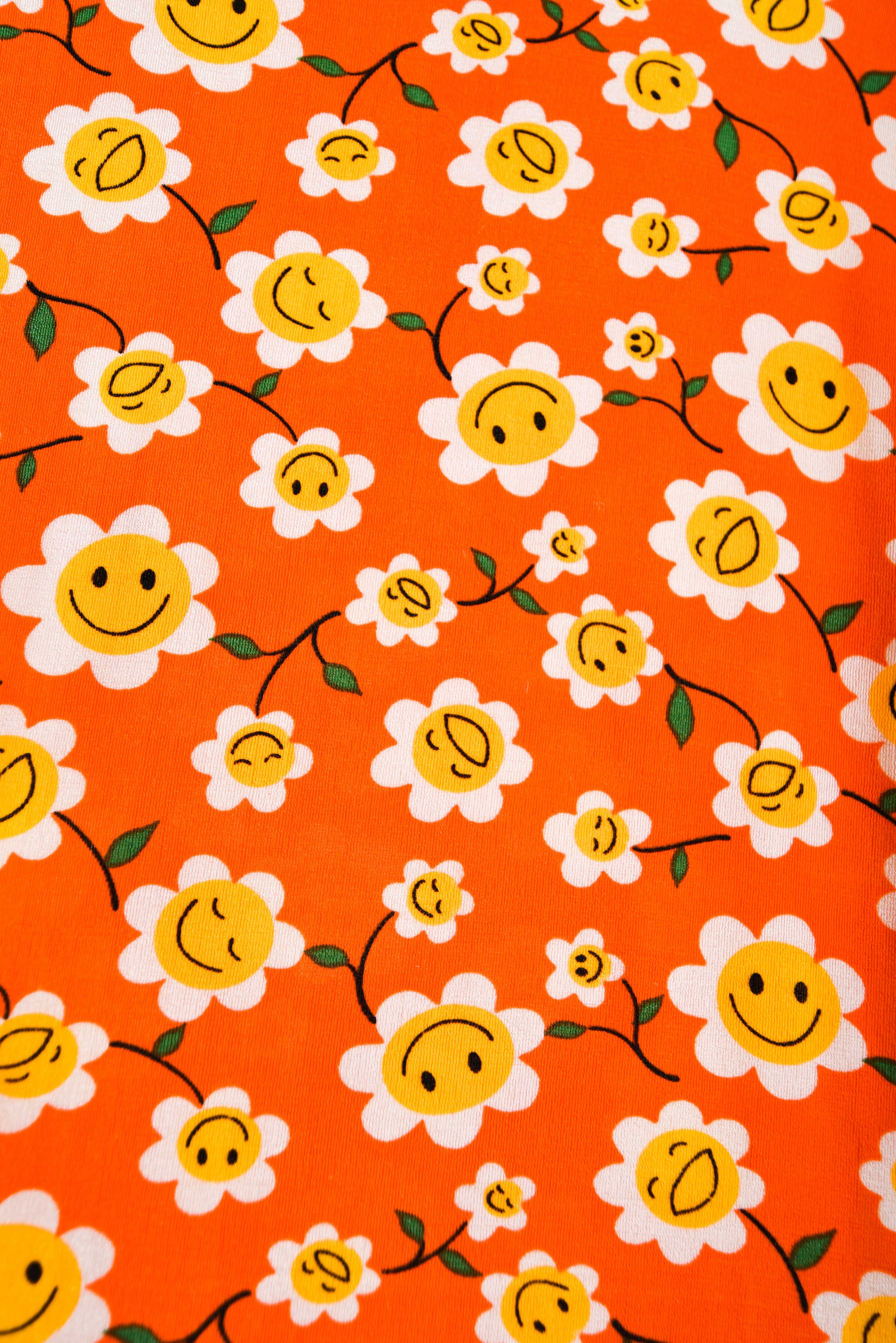 Polera naranja 90s smiley floral 