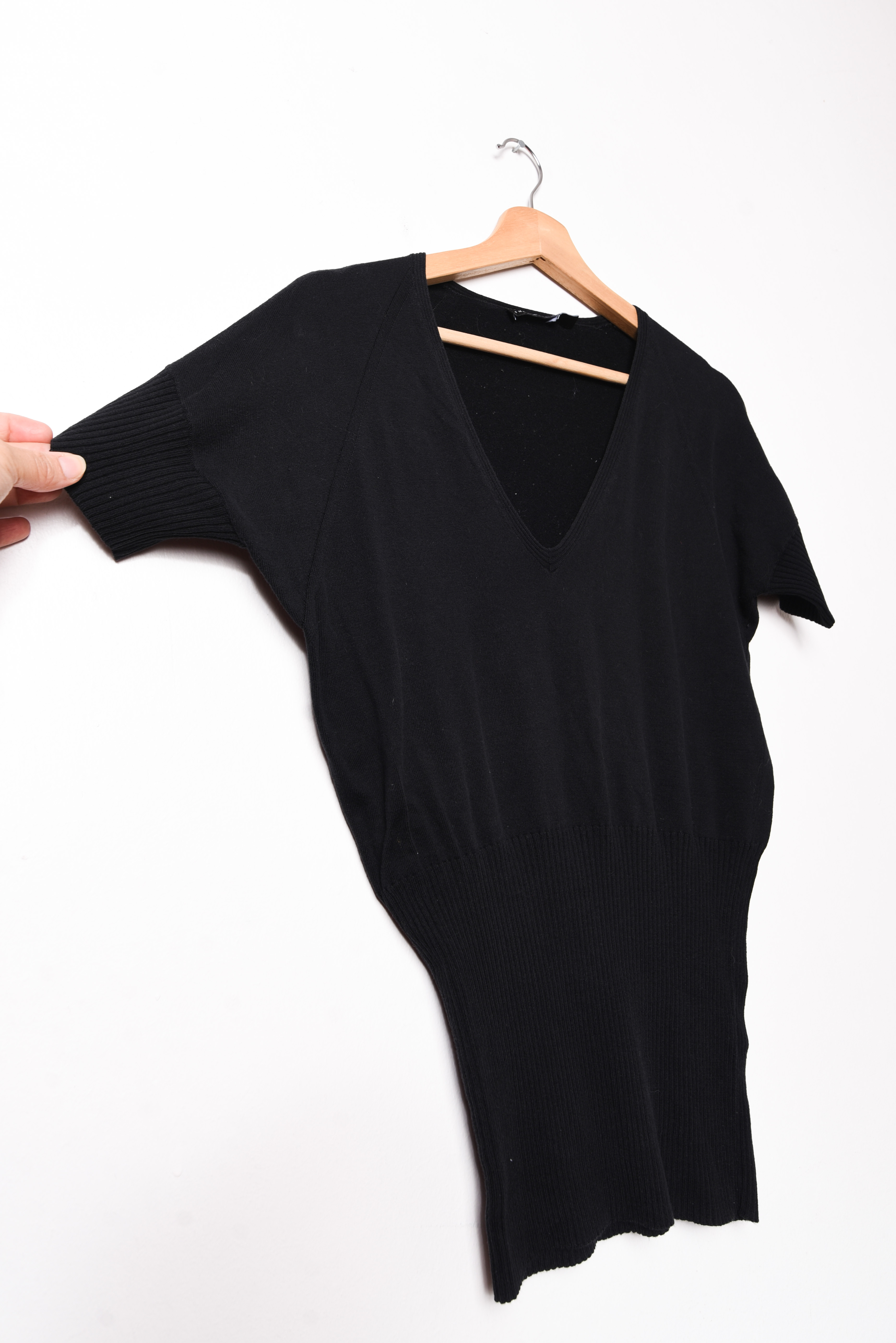 Top tejido negro manga murciélago