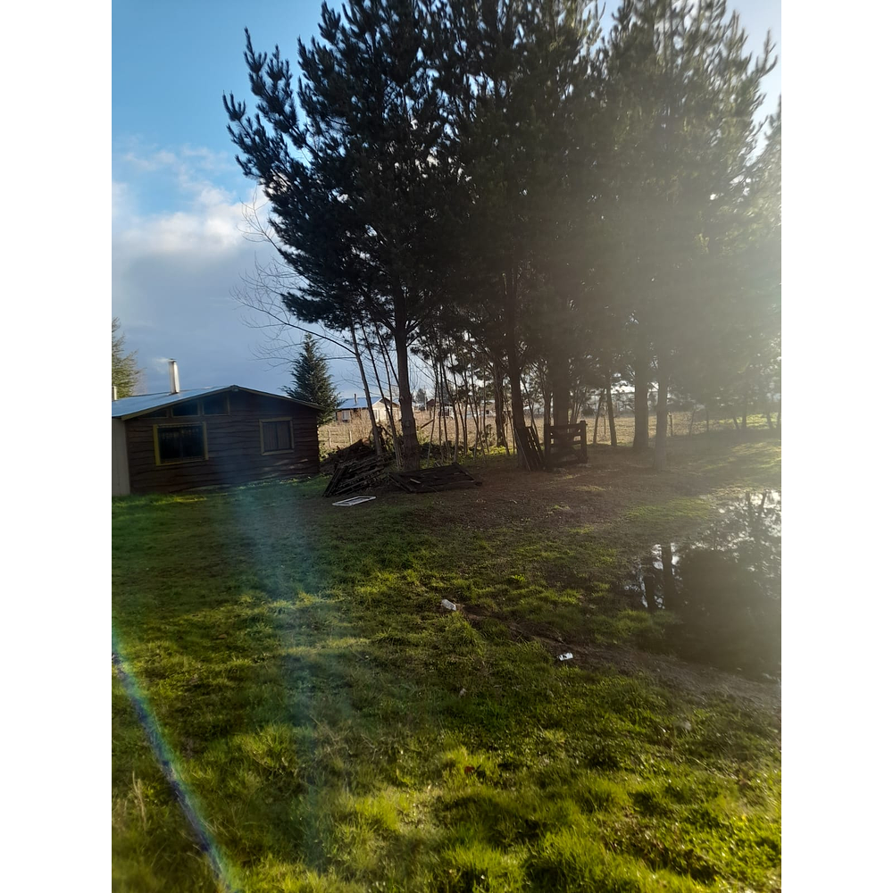 PARCELA CON CASA Y CABAÑA A ORILLA CARRETERA RUTA FREIRE A VILLARRICA SECTOR PUQUEREO