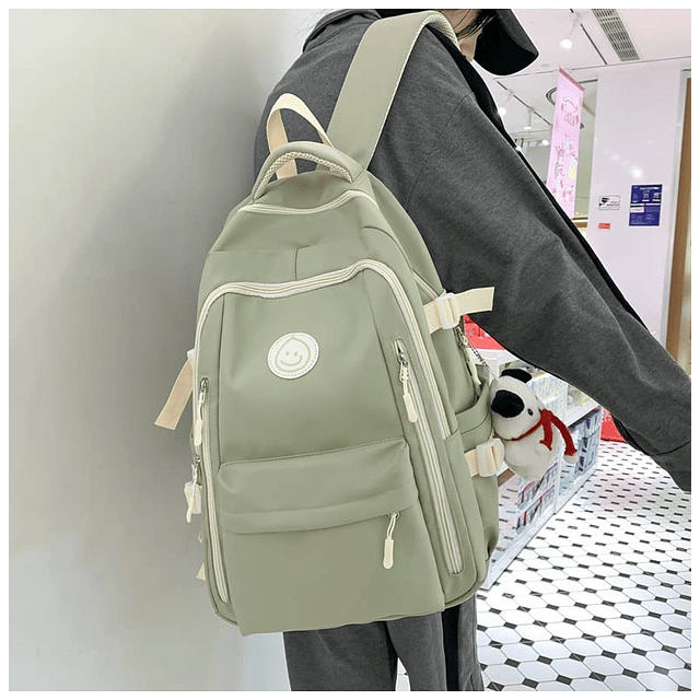 Mochila Preppy con lindo colgante para mujer, cara sonriente