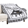 Manta con estampado de piano, teclas de piano, notas musical