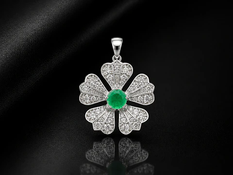Dije en plata con esmeralda