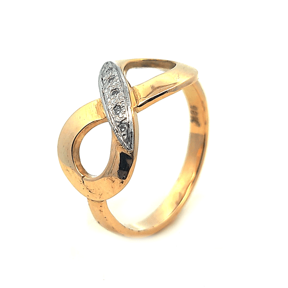 Anillo de oro 18 con diseño de infito y circones, peso 4,00 grs, talla 17