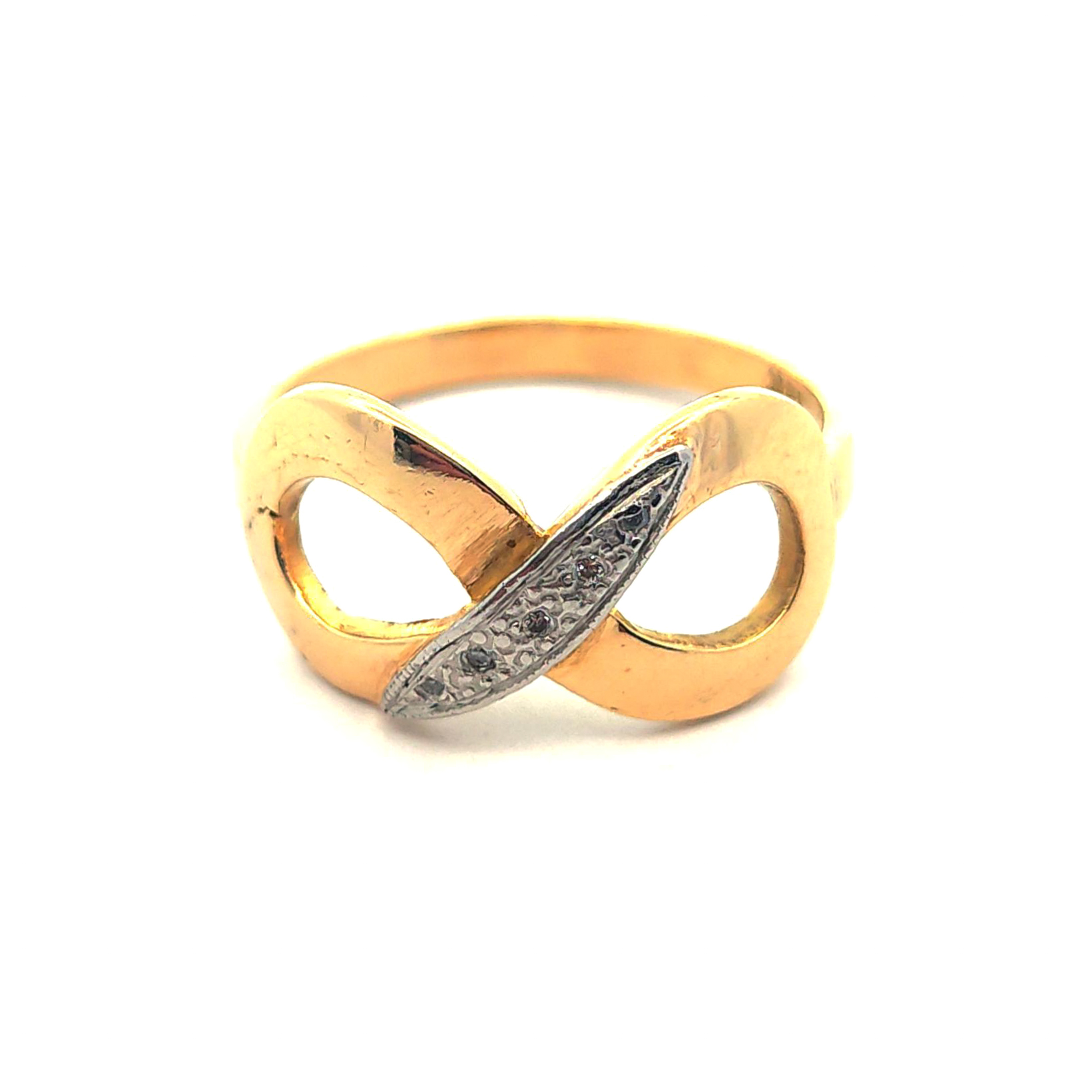 Anillo de oro 18 con diseño de infito y circones, peso 4,00 grs, talla 17 3