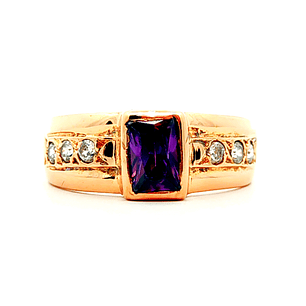 Anillo de oro 18k solitario con circon central morado, peso 2,85 grs talla 11